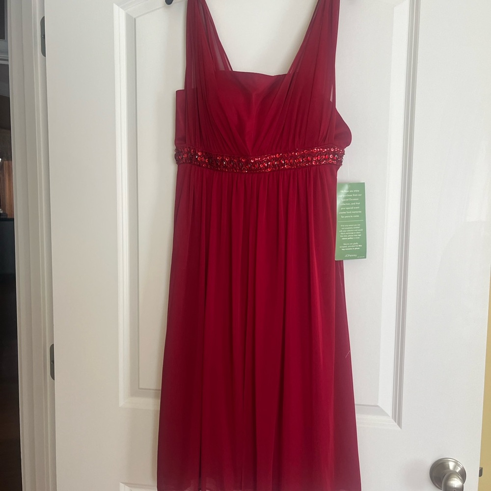 Nice party dress- tags still on it. Burgundy- too small for me now